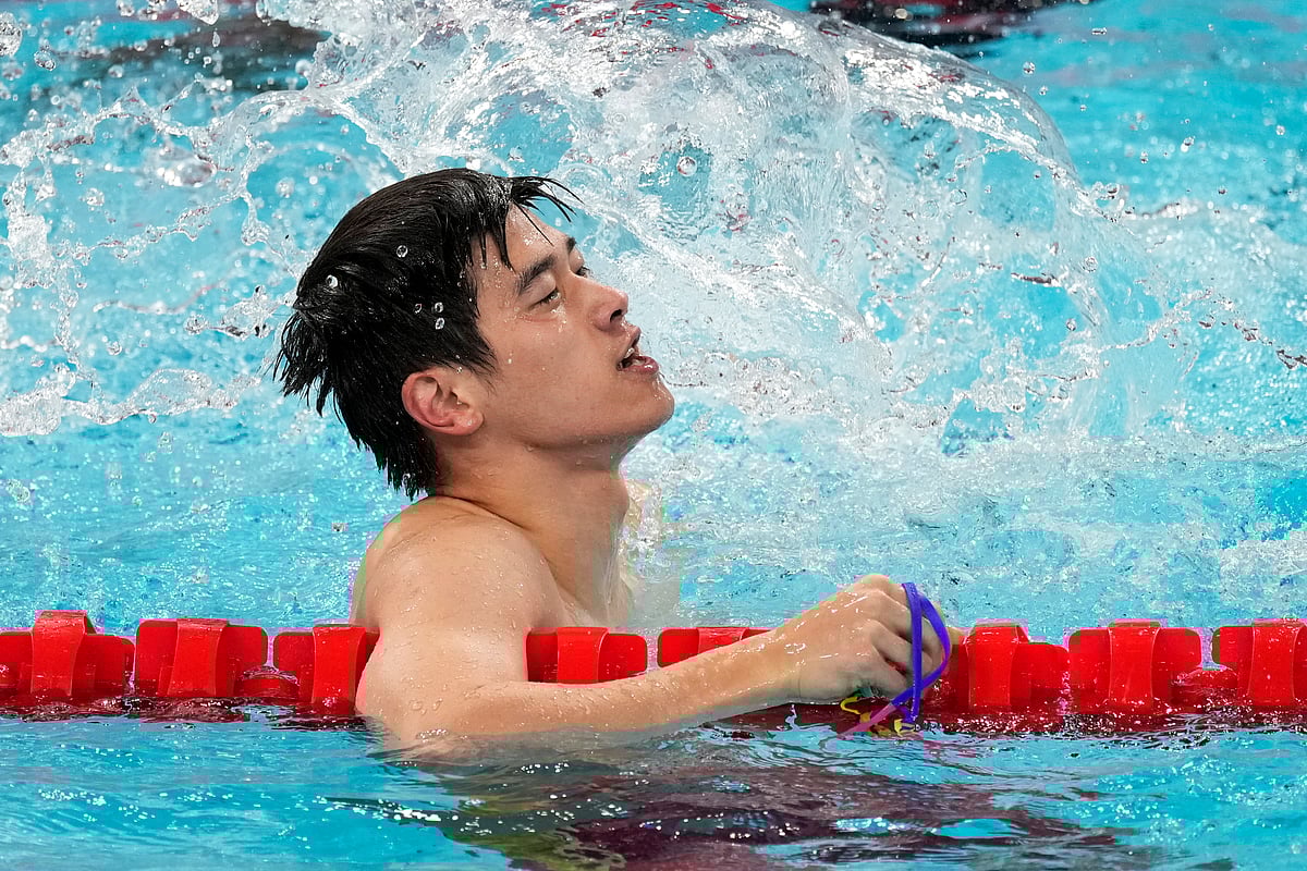 Pan Zhanle, of China, celebrates after winning the men's 100-meter freestyle final at the 2024 Summer Olympics, Wednesday, July 31, 2024, in Nanterre, France.
 -  (AP Photo/Martin Meissner)
